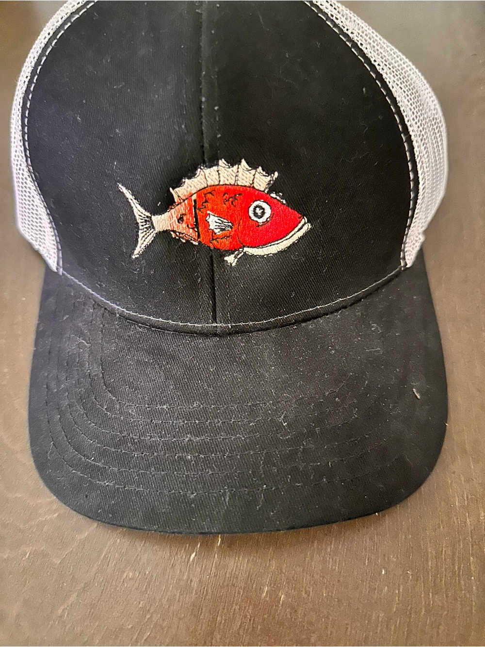 Red fish grill embroidered logo trucker hat unisex. NWOT